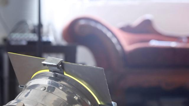 Picture of an antique chaise lounge and studio lights