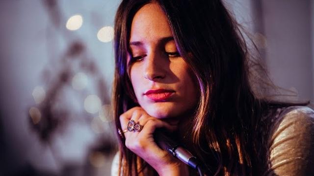 Close-up of Samsaruh holding a microphone